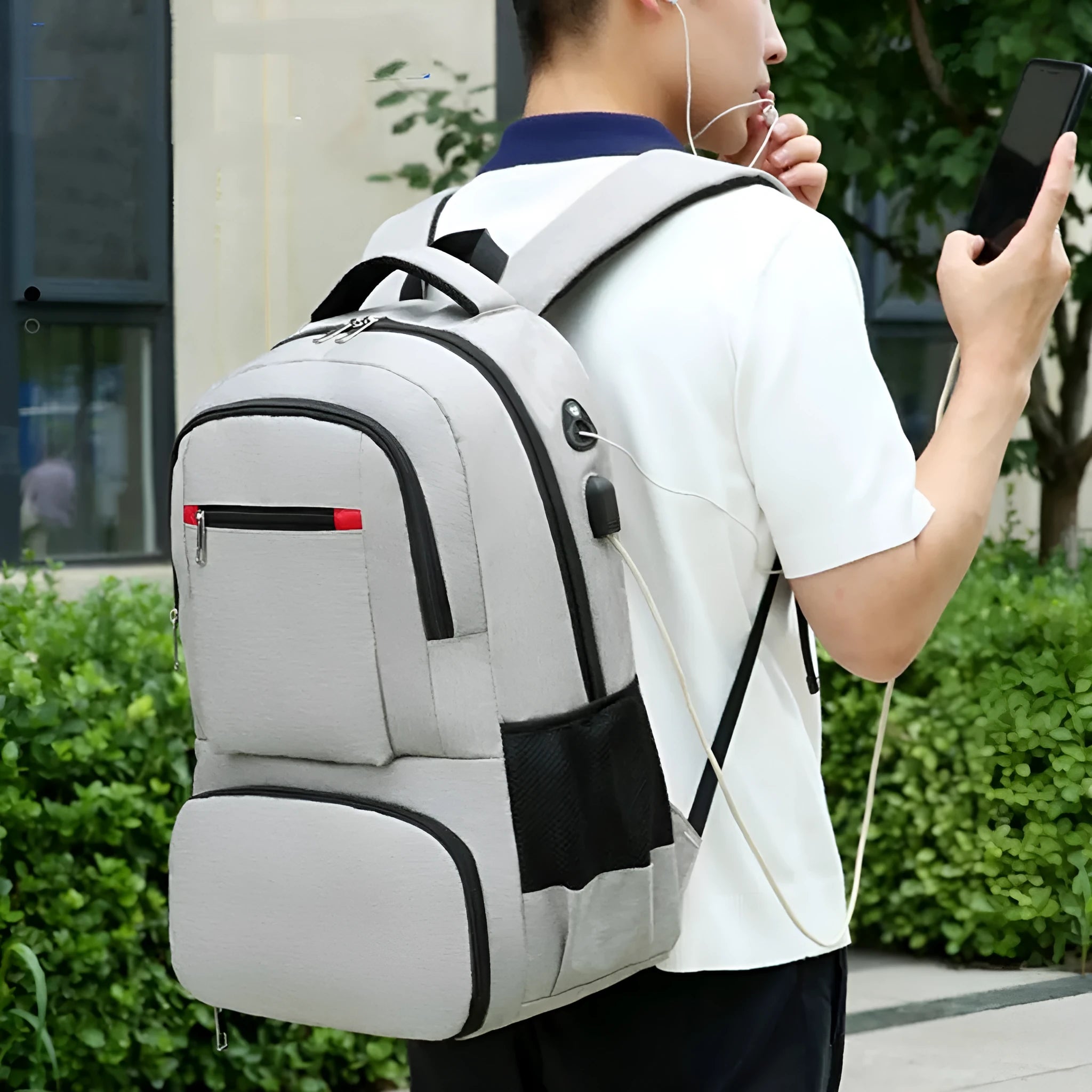 Light grey insulated oxford cloth backpack with curved shoulder straps showing dry-wet separation compartments