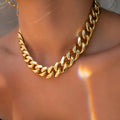 Gold coloured thick chain necklace for women, 32cm long with a 6cm pendant drop.