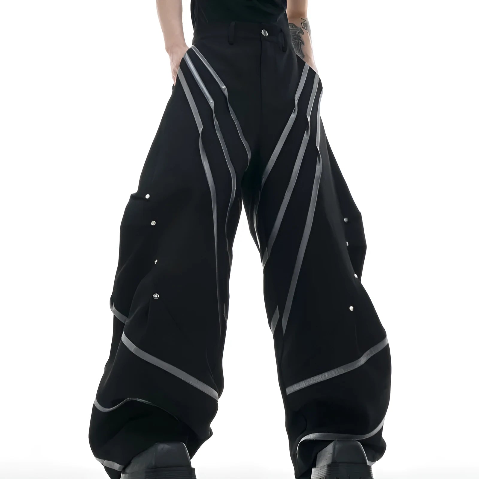 Men's polyester trousers with metal striped rivets and pleated detailing in black or white options