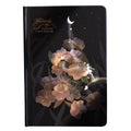 A5 diary notebook with luminous holographic cover open to show pages with colour illustrations.