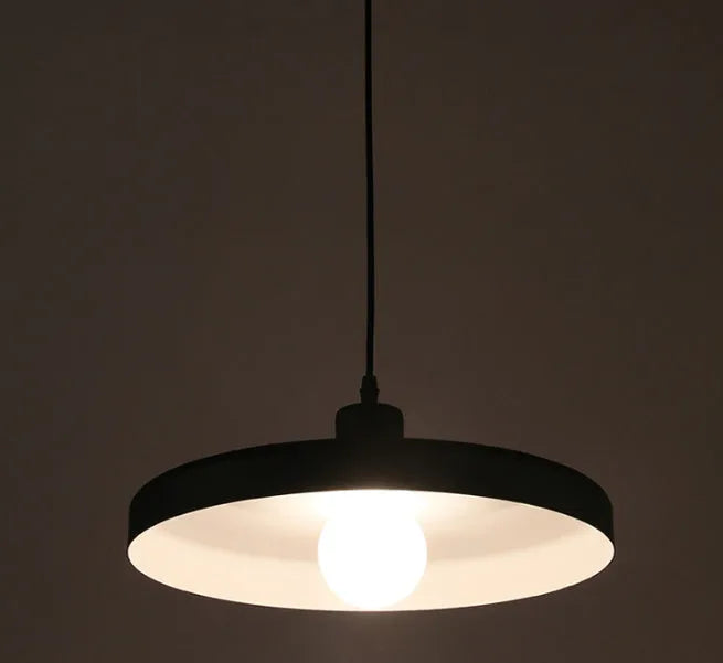 Aluminium alloy bar chandelier light fixture in black finish, shown in a restaurant setting.