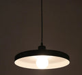 Aluminium alloy bar chandelier light fixture in black finish, shown in a restaurant setting.