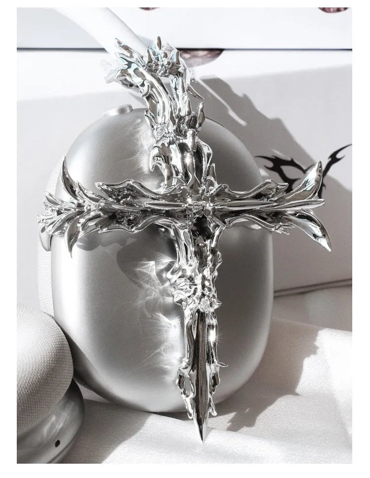 Gothic cross design resin hard case cover for Apple AirPods Max headphones in silver colour.