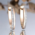 Women's V-shaped geometric earrings in champagne gold white diamond colour with electroplated copper construction