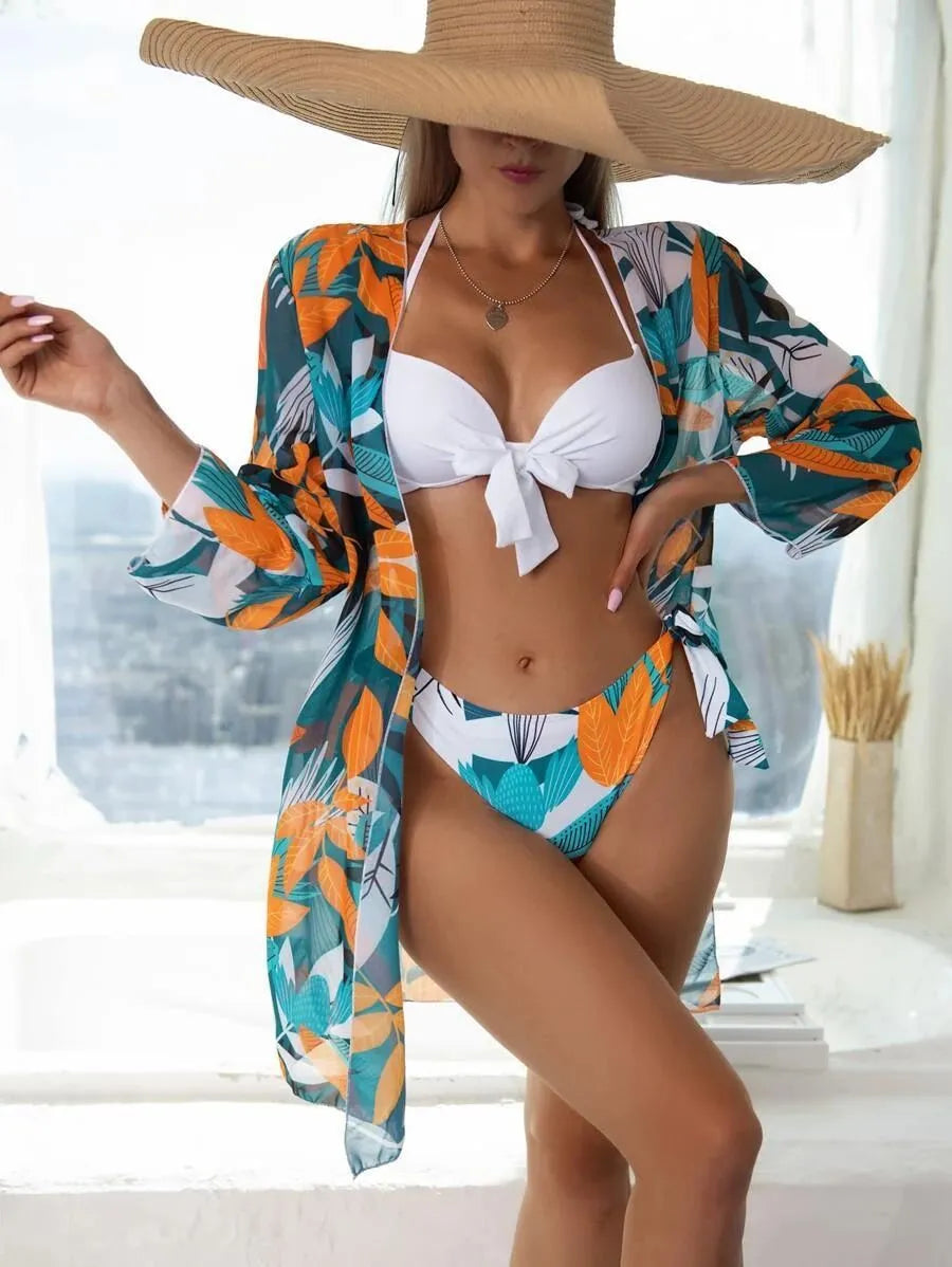 Women's three-piece bikini swimsuit set with mesh split design and cover-up coat