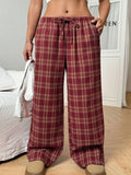 Women's casual plaid trousers with drawstring waist and side pockets in blue or red colours