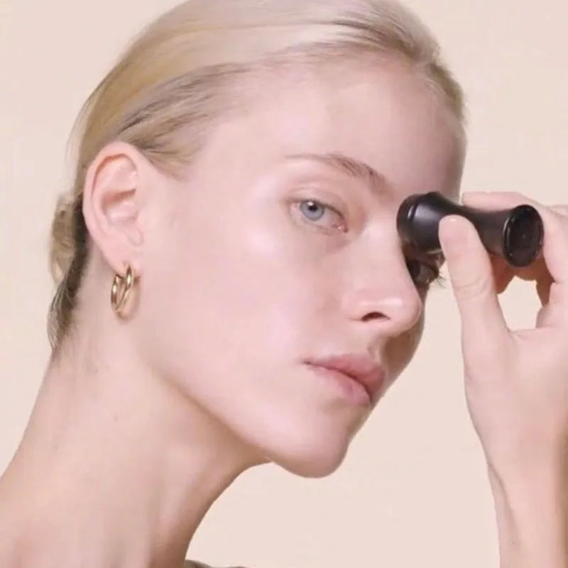 Volcanic stone portable facial roller for oily skin control in black, green, pink, or white.