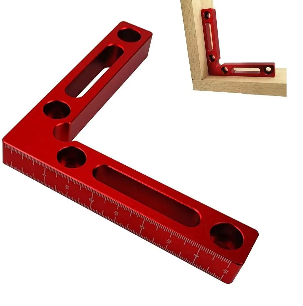 Aluminium right angle woodworking positioning block or jig on a workbench.