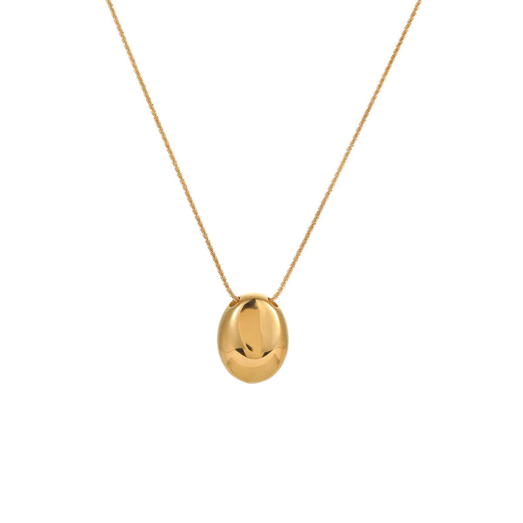 Gold-plated geometric pendant necklace with adjustable chain on model