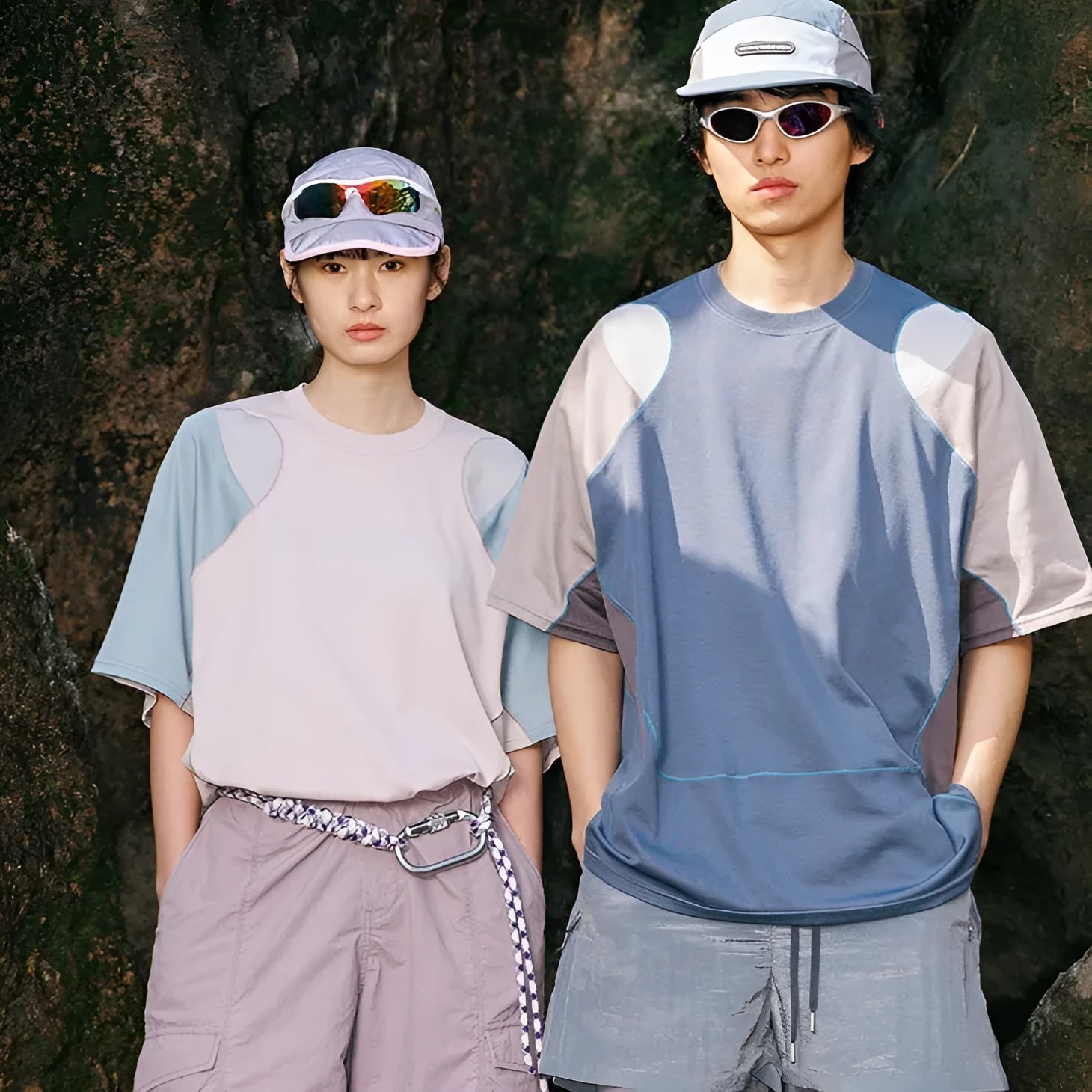 Men's loose grey and blue patchwork sports T-shirt with raglan sleeves on a hanger