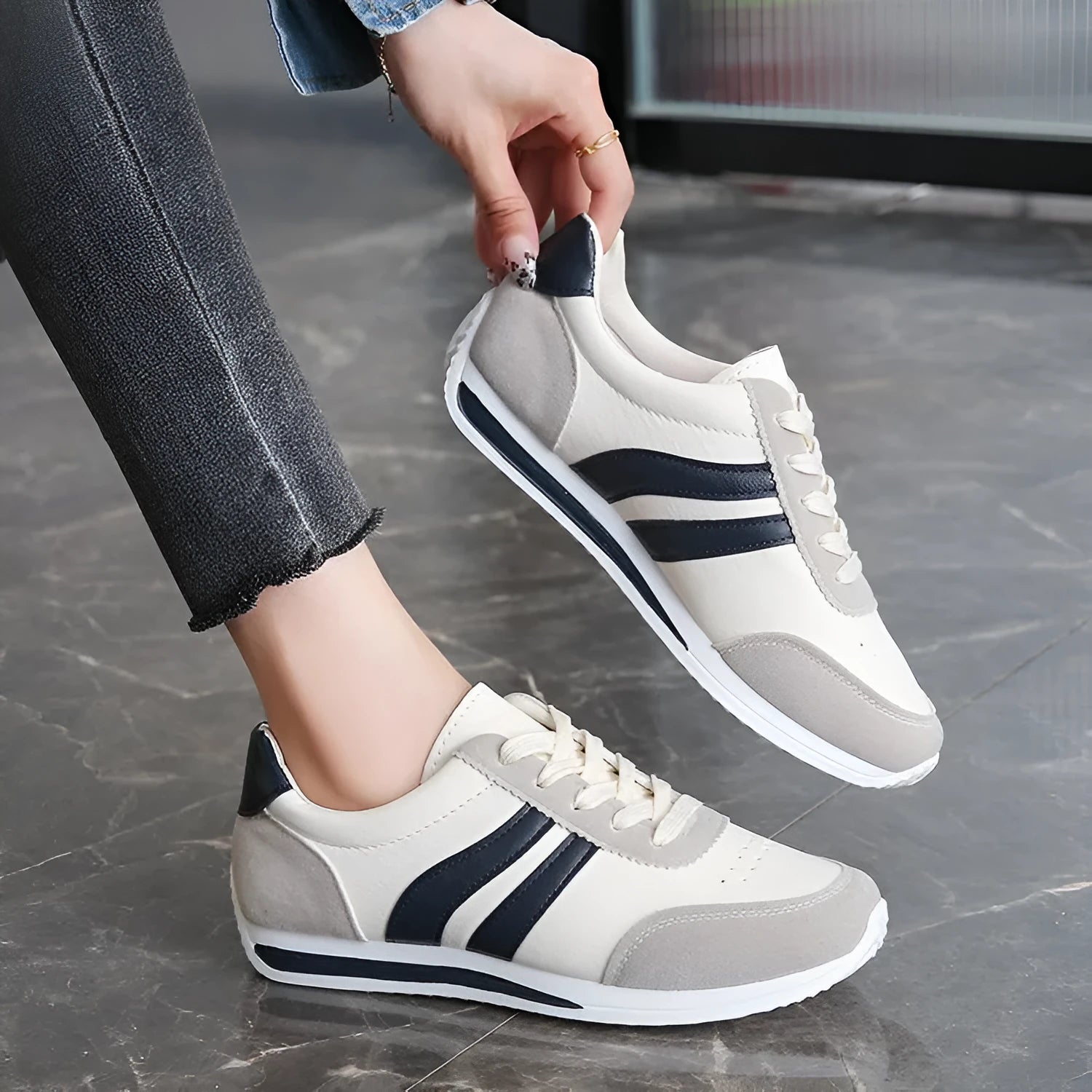 Red and blue low-top lace-up leisure sneakers with round toe and rubber sole.