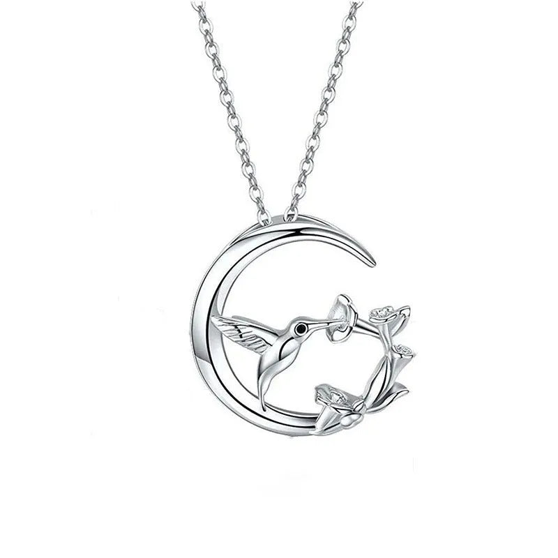 Copper necklace with morning glory blossom and hummingbird pendant in platinum tone on an O-link chain
