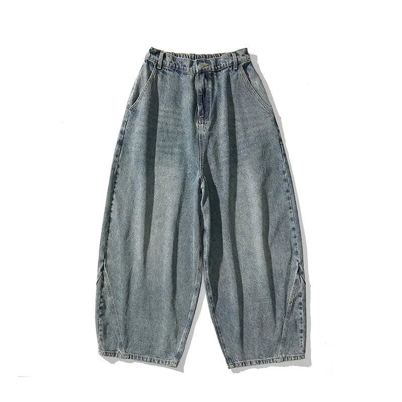 Men's plus size wide leg baggy jeans in black denim on a hanger