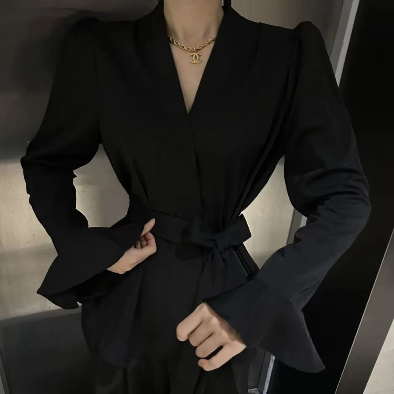 Women's French-style shirt with irregular collar, bell sleeves, and tied front in polyester fabric