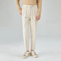 Men's straight-leg corduroy trousers in beige, showing loose fit and textured fabric