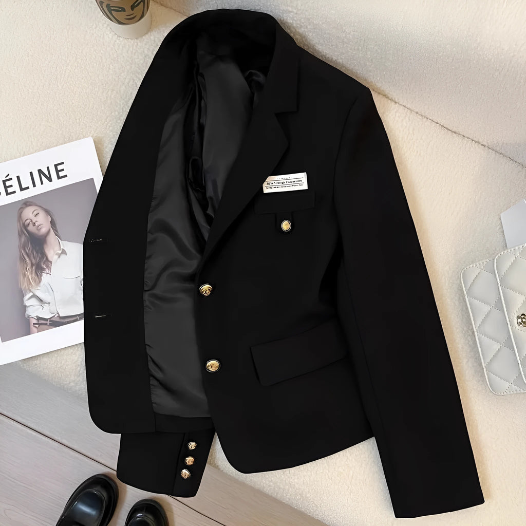 Women's black short suit coat with loose fit, long sleeves, and pockets for commuting style
