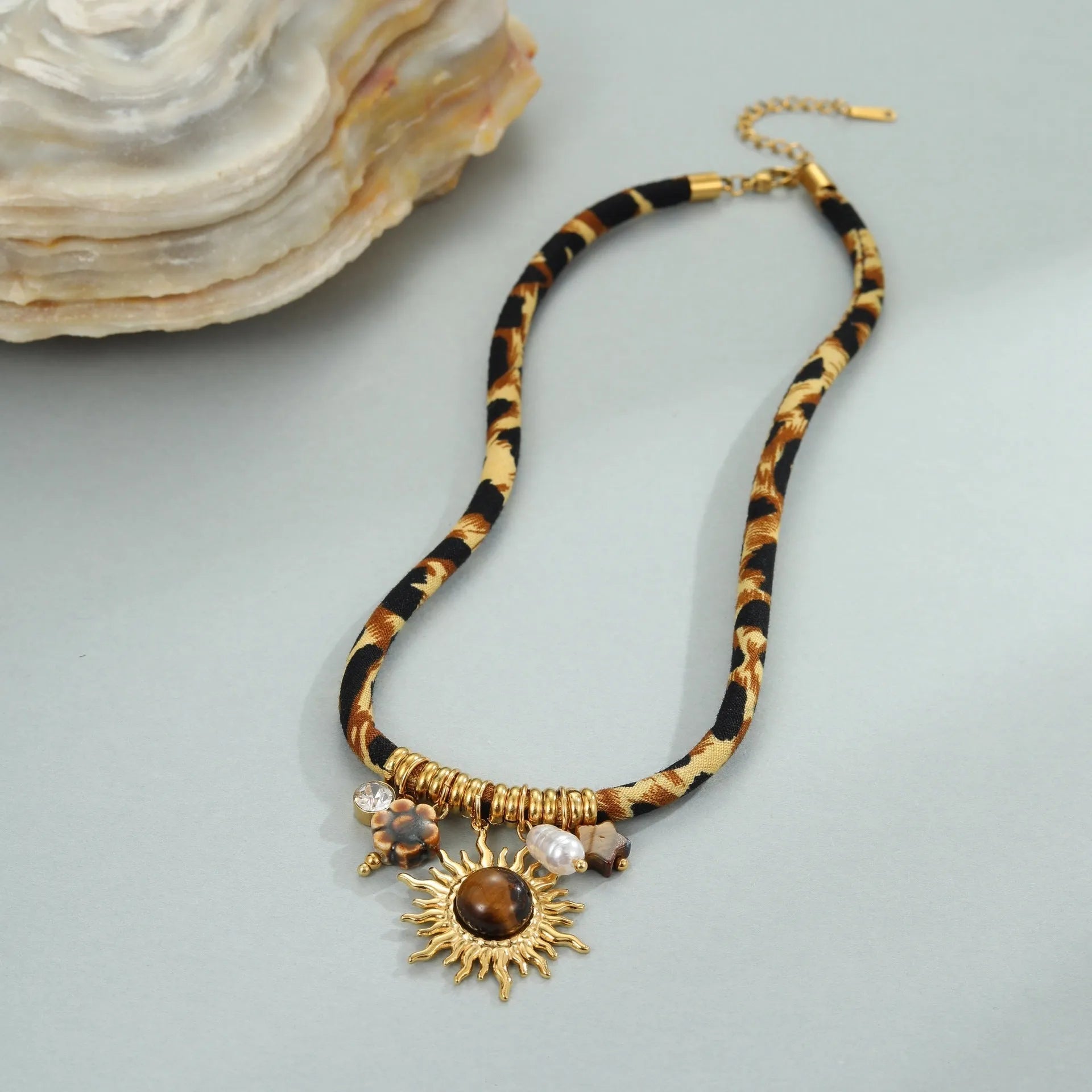 Geometric leopard pendant stainless steel necklace with gold-toned electroplated finish and adjustable chain
