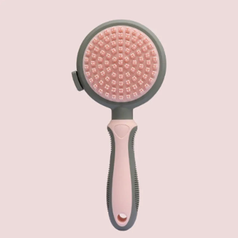 Green and pink 2-in-1 silicone cat grooming brush showing slicker brush and massager sides