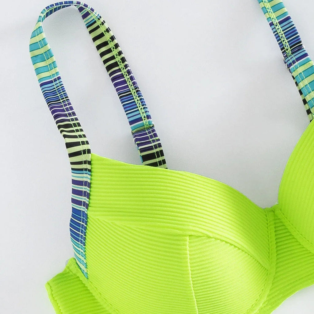 Green women's halter neck bikini set with split briefs, shown as a two-piece swimwear.