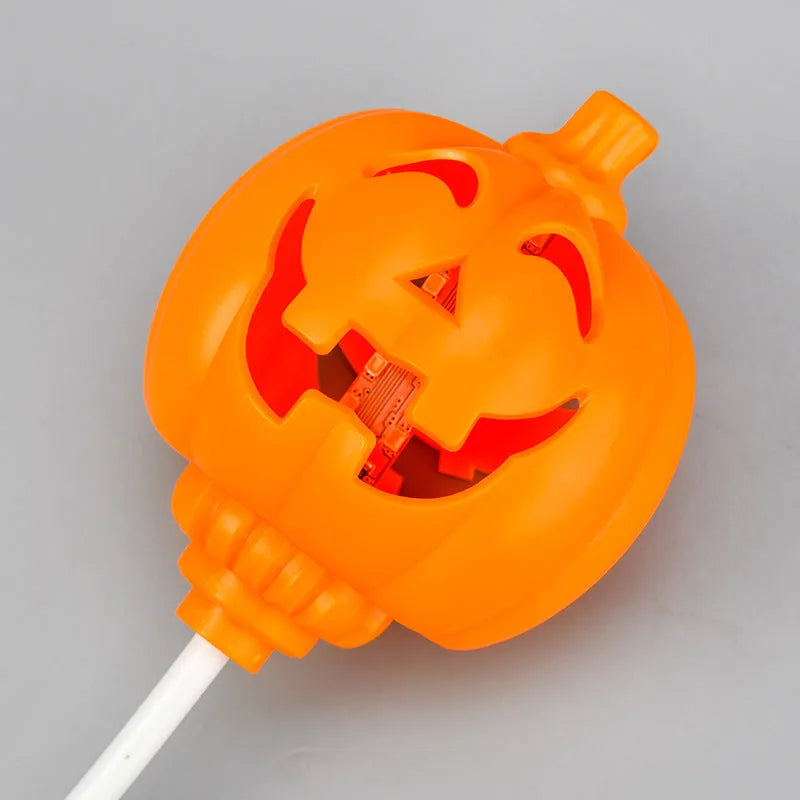Plastic pumpkin lamp with USB cable showing yellow and purple light options