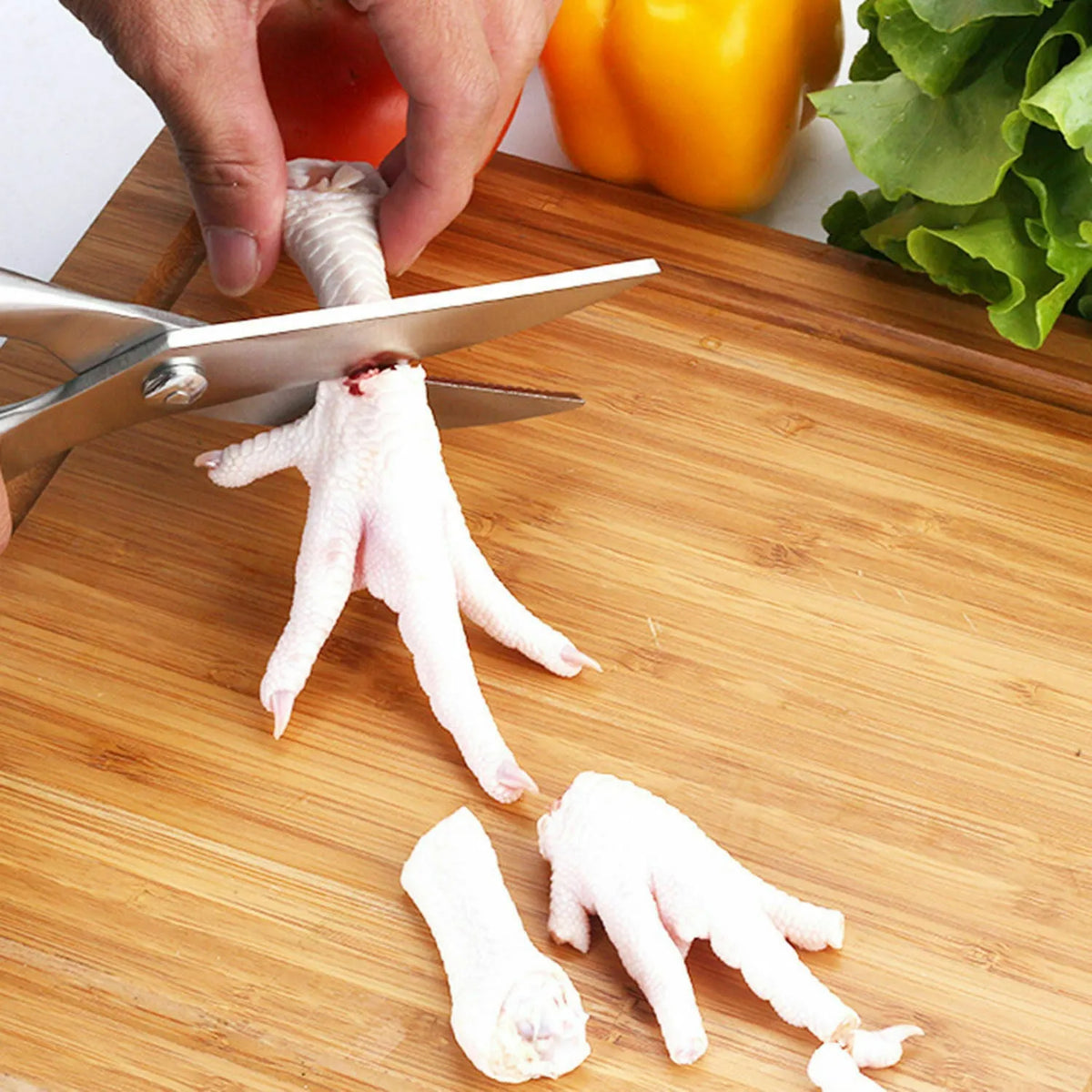 Silver whole stainless steel kitchen shears, 25cm x 4.5cm with 9cm blade, serrated edge and locking handle.