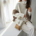 Women's high-neck loose fit thick knit pullover sweater in solid colour, long sleeves