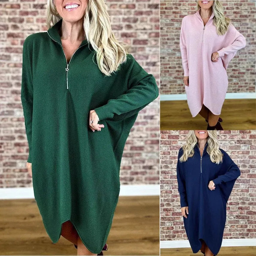 Women's solid colour loose fit knitted dress with raglan sleeves and a zip detail.