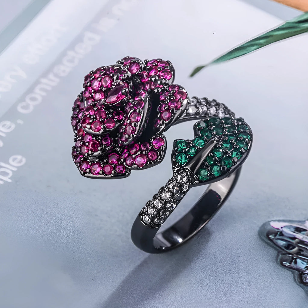 Black gold geometric flower personality ring with red corundum simulation stone on female hand
