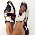 Women's black and white apricot animal print suede shoes with pointed toe and low heel.