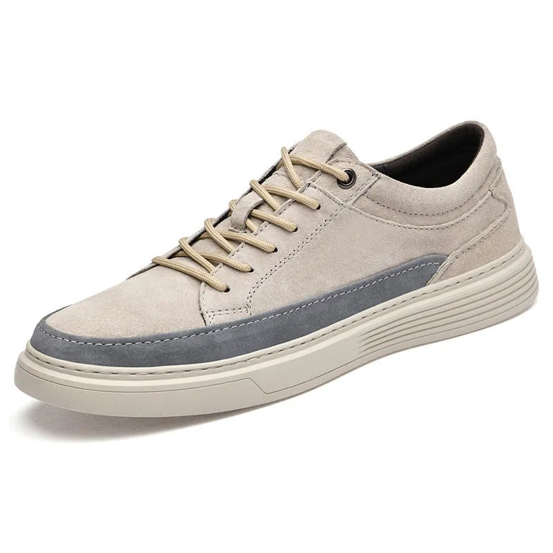 Men's grey casual skate shoes with pigskin upper and rubber sole on white background