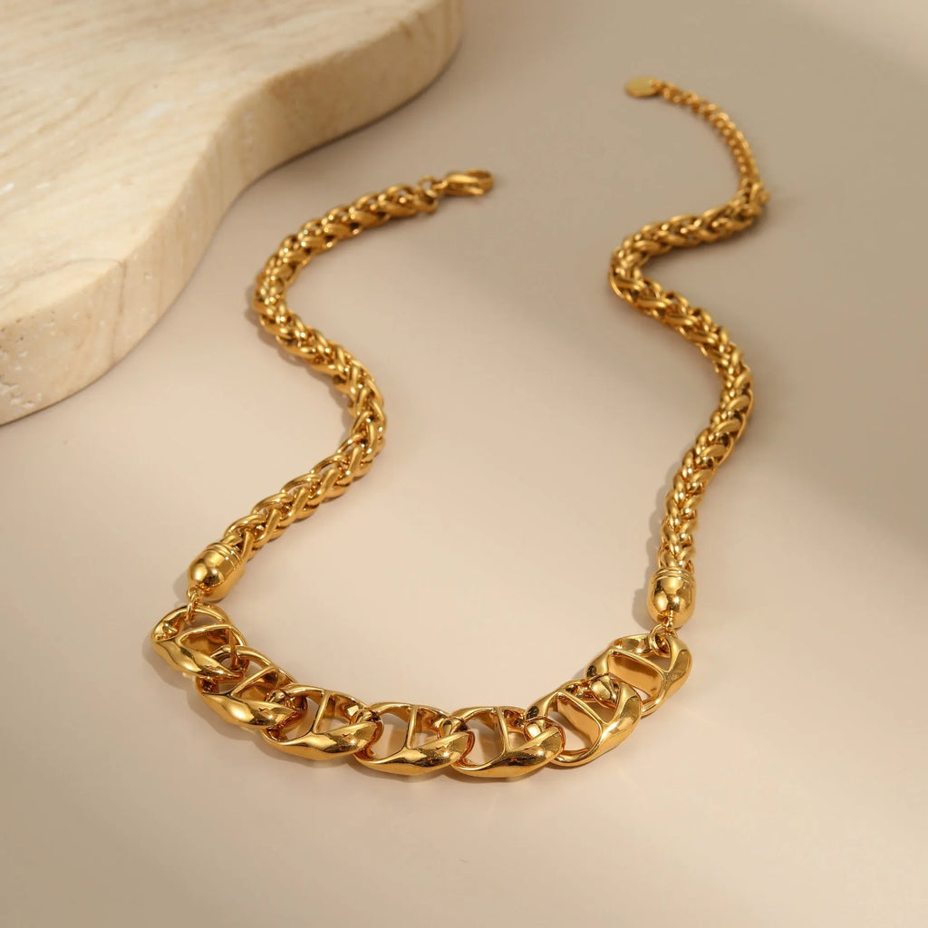 Stainless steel geometric necklace with 18K gold plating in gold and steel colour options