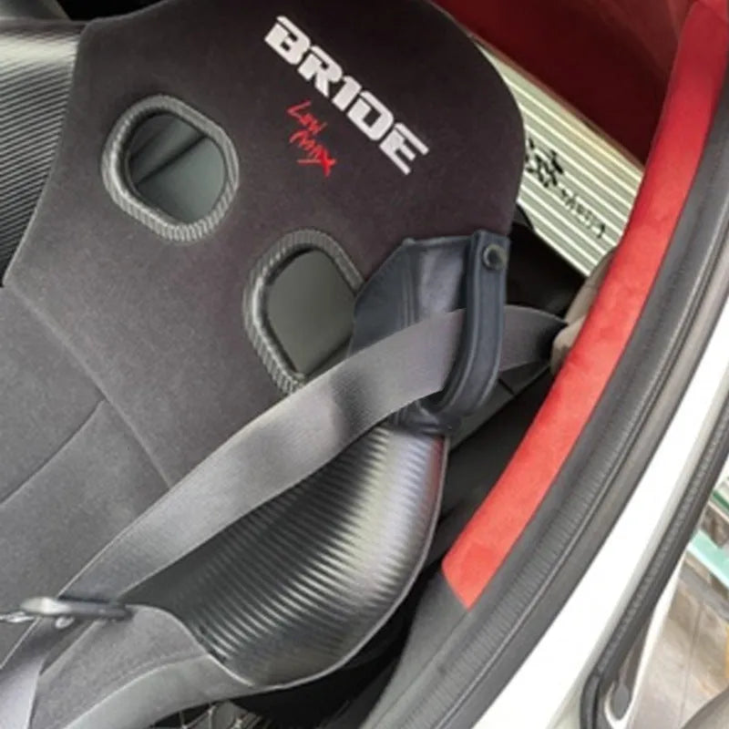 Black leather racing seat belt buckle cover measuring 30cm by 20cm for RECARO and Bride harnesses.