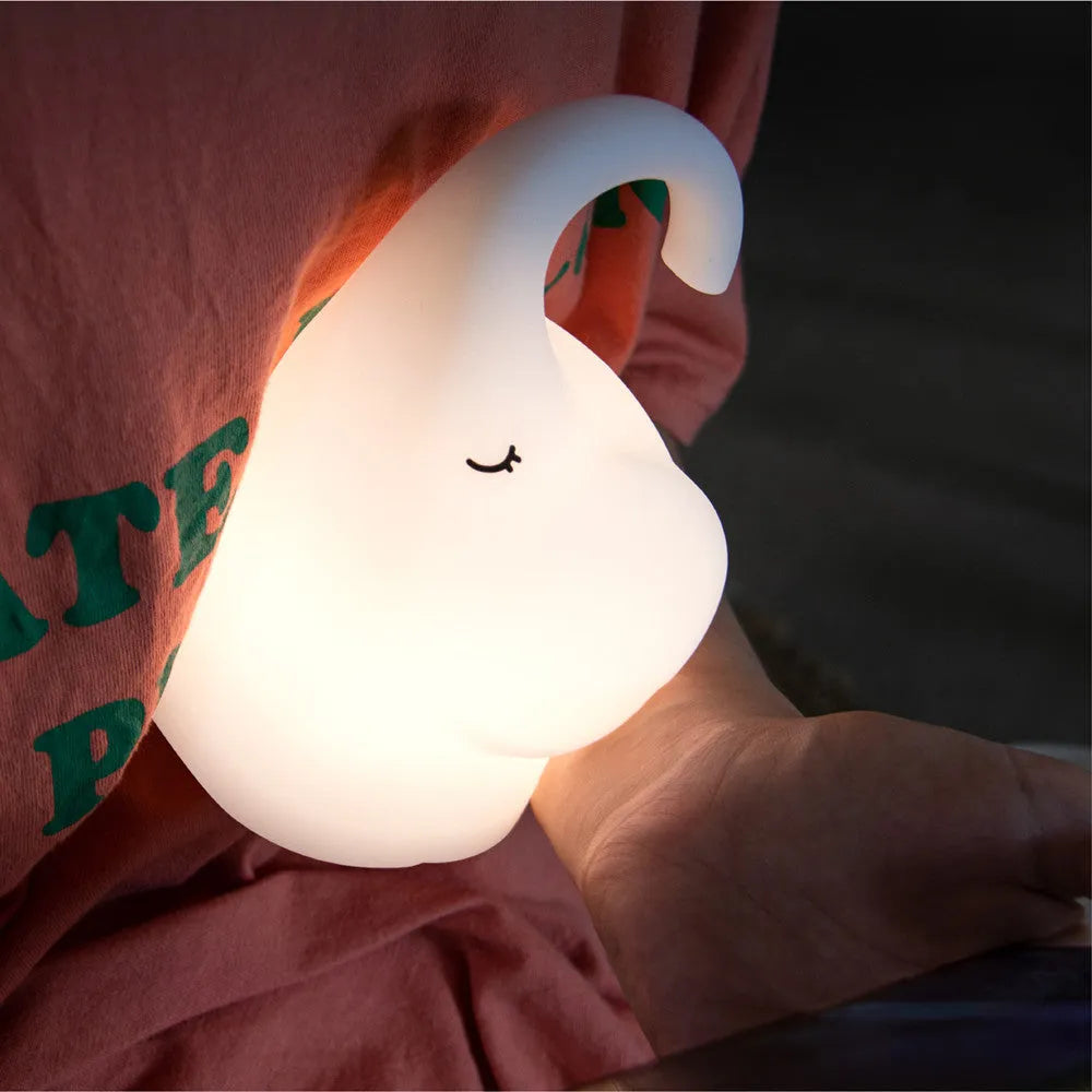 DOMI Elephant Silicone Night Light with warm LED lighting on bedside table