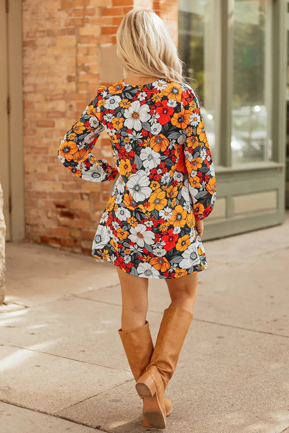 Orange floral print women's mini dress with V-neck, long sleeves, and lace trim