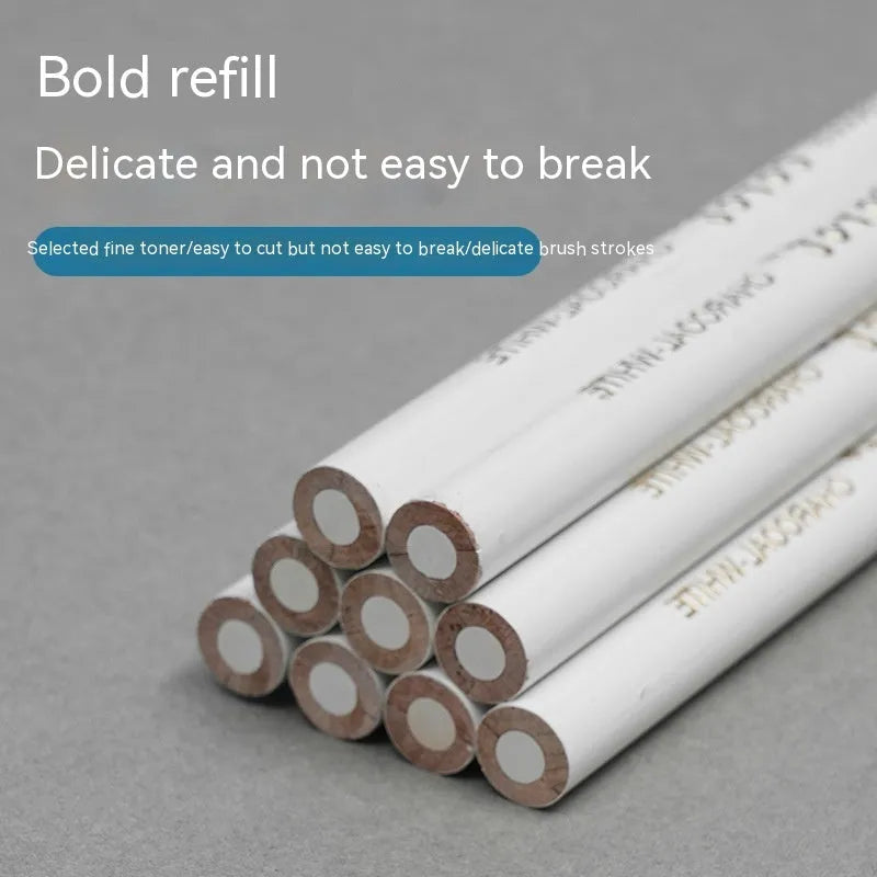 Three white charcoal pencils in wooden casings for drawing highlights on dark paper