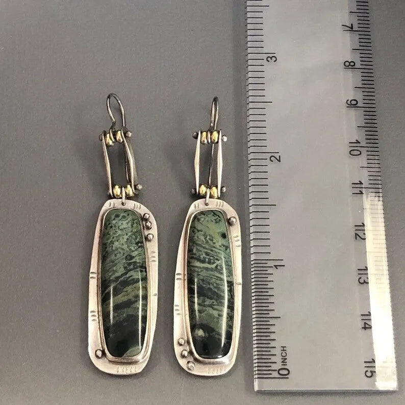 Geometric two-tone marble pattern alloy drop earrings on a white background