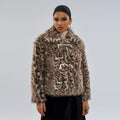 Women's leopard print polyester coat with regular sleeves on a hanger
