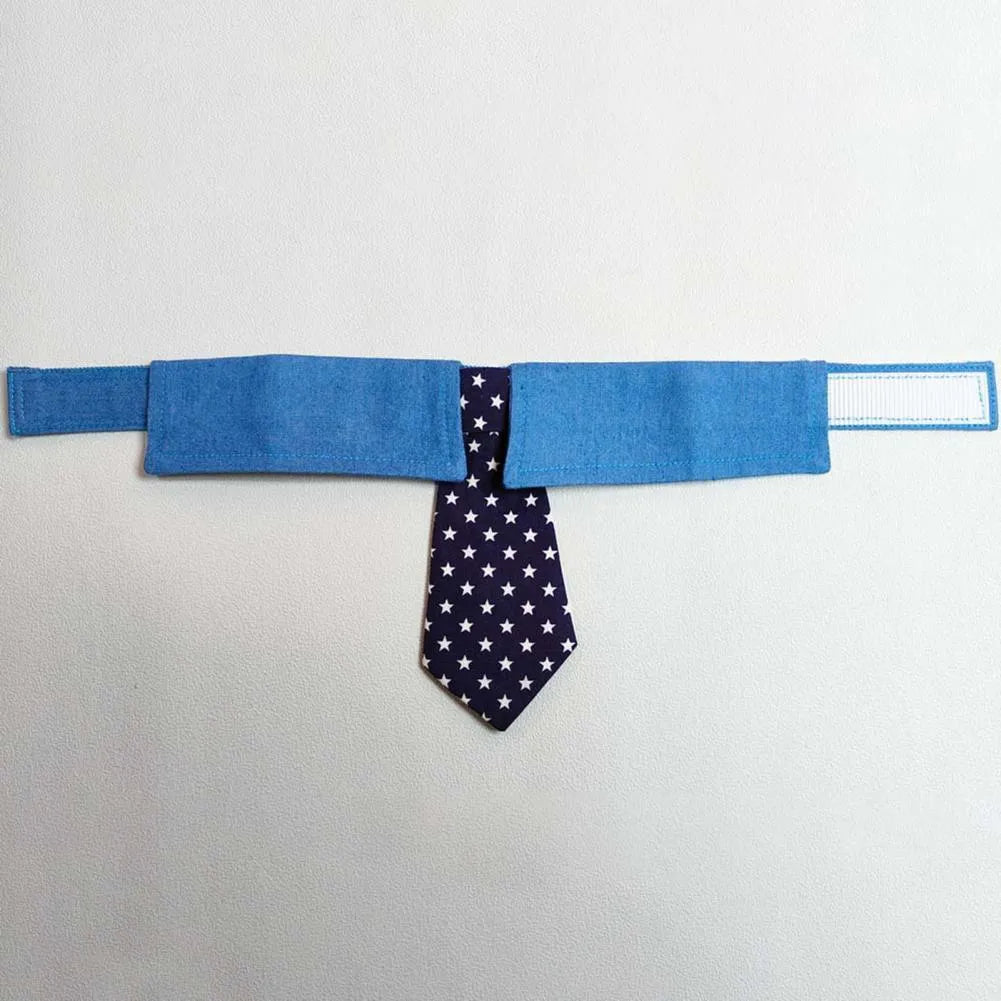 Denim dog collar with star pattern and attached bow accessory on adjustable fastener tape