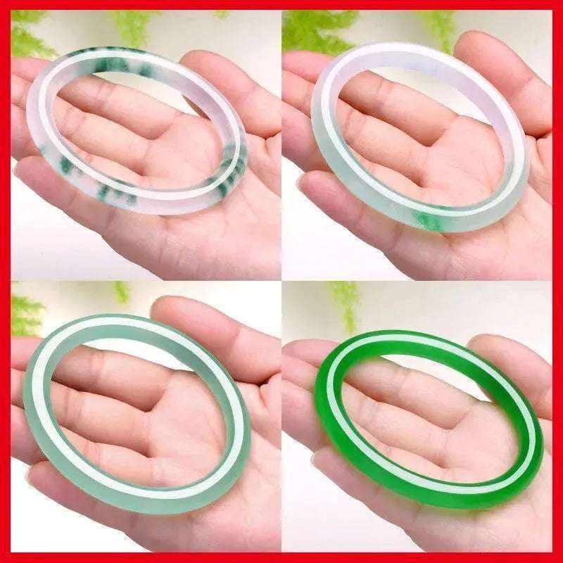 Jade bracelet with floating flower design in ice-like emerald tones and auspicious patterns