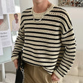 Men's black loose fit long sleeve sweater cotton blend on model front view