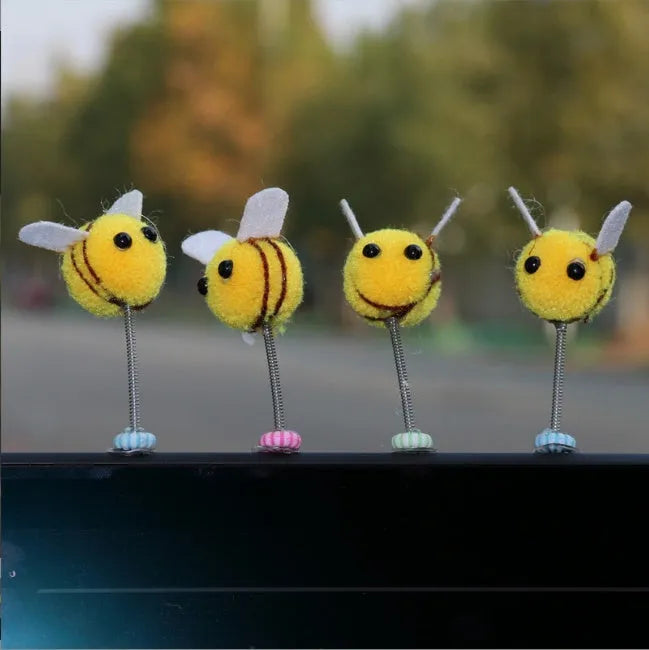 Small furry brown and yellow cartoon bee car decoration ornament measuring 3cm