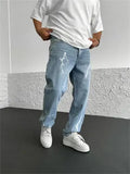 Men's blue straight-leg cotton denim jeans with loose fit and mid-waist design