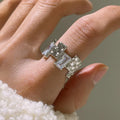 Silver plated open ring with geometric cross zircon and retro design.