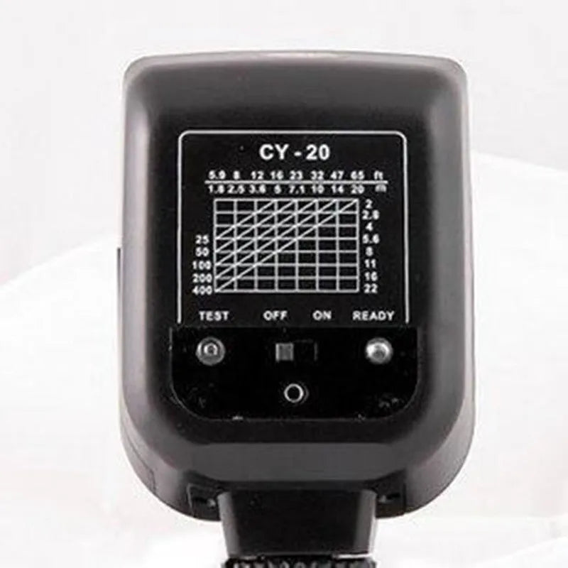 Compact black hot shoe flash unit tilted upwards on a DSLR camera