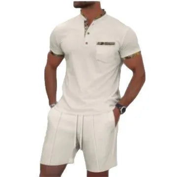 Man modelling a grey waffle knit zip-up polo short sleeve top and matching shorts.