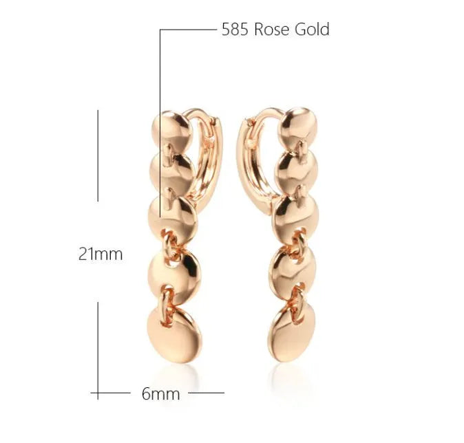 A pair of gold-coloured retro long round circle earrings with a woven texture, made from copper.