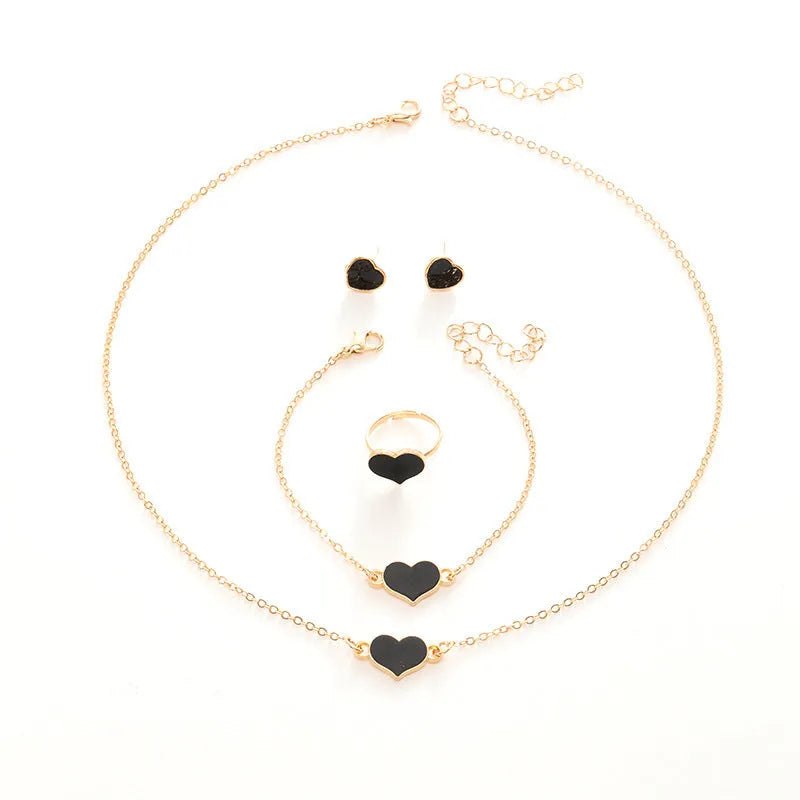 Women's four-piece jewellery set with heart pattern necklace, bracelet, ring and earrings in electroplated alloy