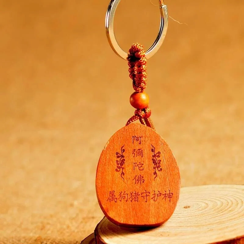 Eight patron saint keychains in peach wood colour, each 10 x 3.2 x 4 cm, Taomu Buddhist keychain set