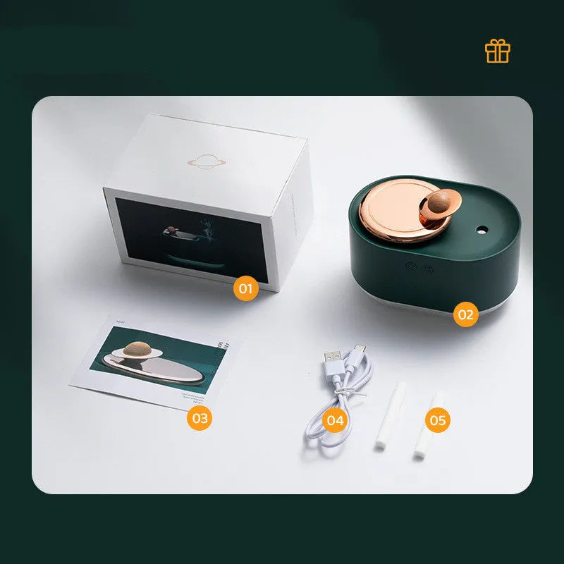 Green rotating planet-shaped USB humidifier with night light on a table