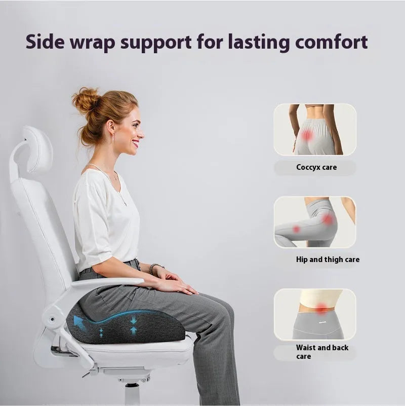 Light grey memory foam office chair cushion on a wooden chair seat.